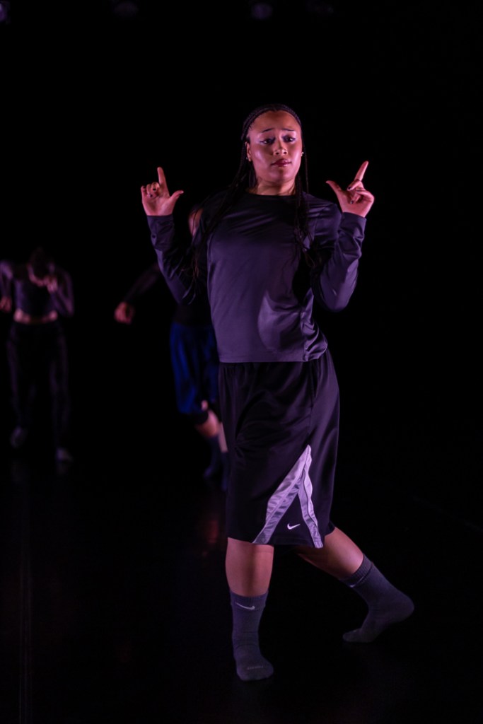 dancer forming L shape with each hand