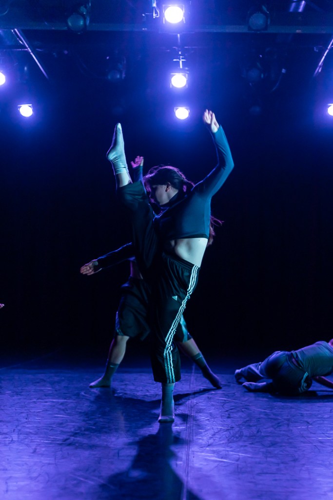 dancer holding a high kick with toe pointed